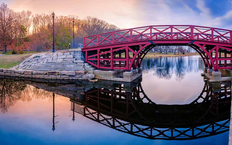 Red bridge over a river in Worcester, Massachusetts.